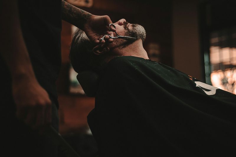 Professional barber cutting hair
