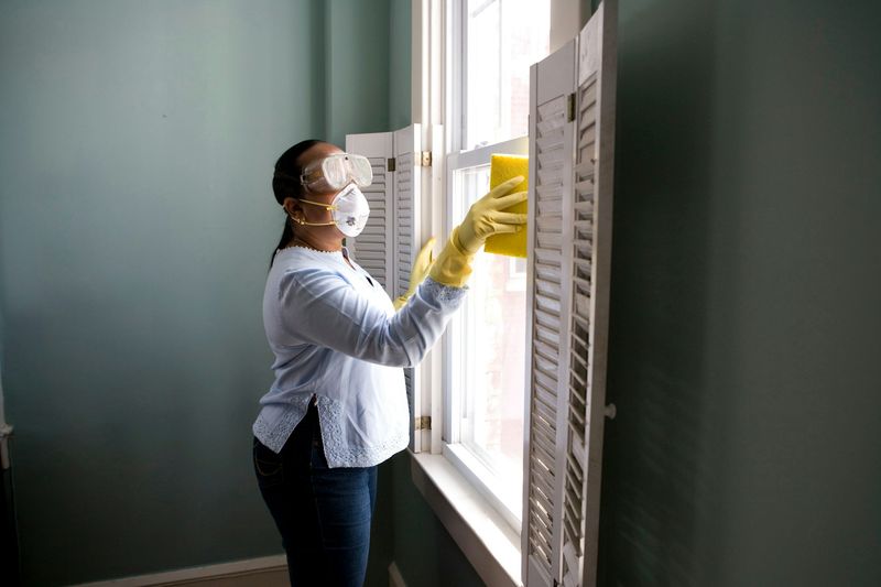 Professional cleaner cleaning a modern home