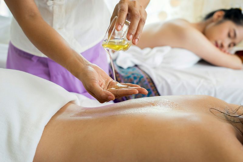 Professional massage therapist providing massage