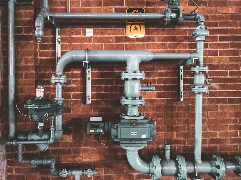 Professional plumber repairing pipes