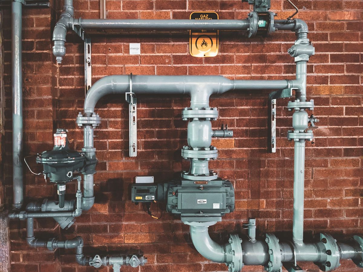 Professional plumber repairing pipes