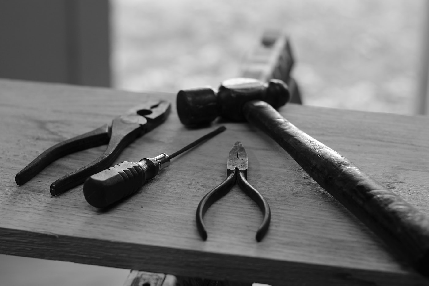A curated set of professional tools arranged on a work surface.